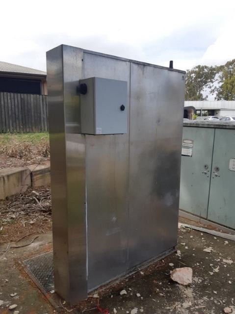External monitoring enclosure on a stainless switchboard cabinet