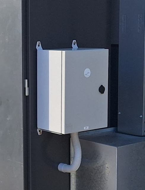 Closed enclosure with a protected cable connection