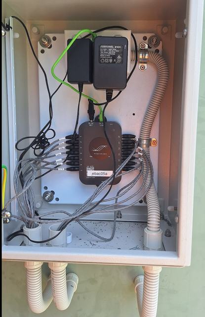 Enclosure interior showing the monitor and cable entries